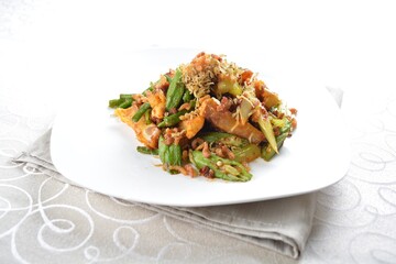 stir fried mixed vegetables with meat in spicy samba chilli sauce in white background asian halal menu