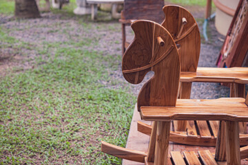 Wooden rocking horse from a childs playroom sitting in the sunlight