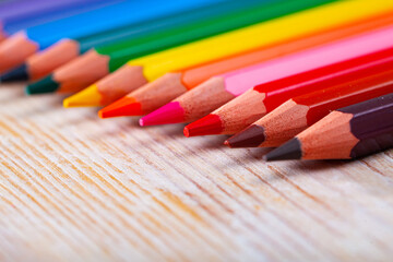 Obraz premium Image of multicolored wooden pencils on wooden surface