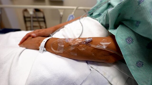 IV intravenous line in female arm close up