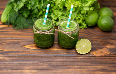 Green detox drink. Fresh green smoothie. Healthy food and drink concept. A glass of green smoothie...