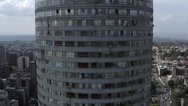 Drone close panning shot close to Ponte City Apartments, skyscraper, Berea, Johannesburg, South Africa.