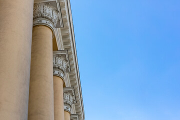 Details of the exterior architecture of the building against the blue sky. Copy space