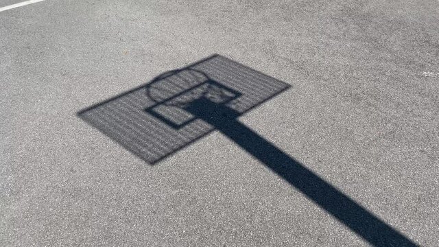 Shadow, silhouette Basketball hoop with the metal board on a school site