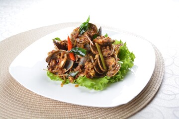 stir fried clam shell seafood with vegetable and chef dry spicy chilli sauce in white background asian halal menu
