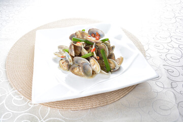 stir fried clam shell seafood with vegetable and chef dry spicy chilli sauce in white background asian halal menu