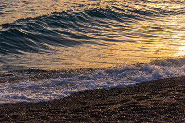 Sunset on the Zlatni Rat beach near Bol town, Brač Island, the Adriatic Sea, Croatia