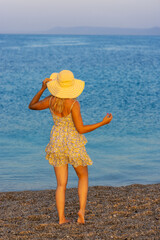 Girl on the Zlatni Rat beach near Bol town, Brač Island, the Adriatic Sea, Croatia