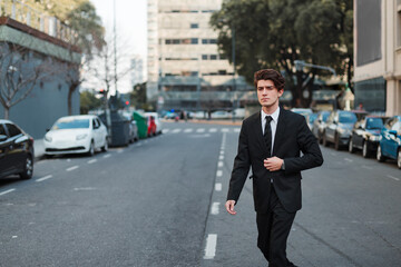 Fototapeta na wymiar young man in casual suit walking down the street