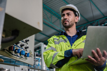technician engineer working to maintenance a construction equipment industry, production technology...