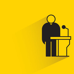 speaker on podium icon on yellow background