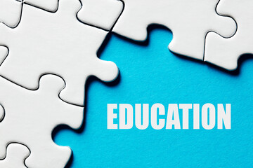 The word education surrounded by puzzle pieces. Educational training and learning