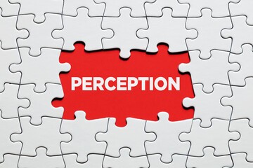 Fototapeta premium The word perception surrounded by jigsaw puzzle. To increase or expand the realm of perception.