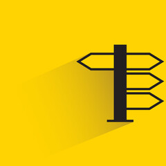 Obraz premium street signpost and signage with shadow on yellow background