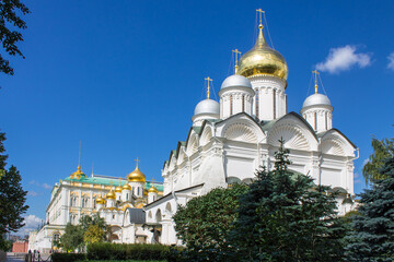Fototapeta na wymiar The Archangel Cathedral in the Kremlin with golden domes shining in the sun on a clear summer day in Moscow Russia