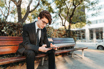 Fototapeta premium young man in casual suit working out in a park outdoors