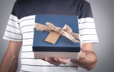 Man with gift box. Christmas. Surprise