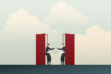 Business people shake hands through two doors Agreed to do business together.