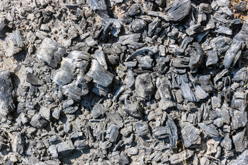 Background of black pieces of charcoal charcoal