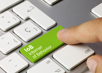 IoB Internet of Behavior - Inscription on Green Keyboard Key.
