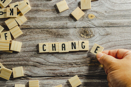 Change word cube on wood background ,English language learning concept