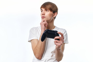 a man in a white t-shirt with a joystick in his hands playing hobby lifestyle