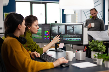 Team of editors women working with modern studio post production software in digital multimedia...
