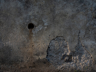 concrete wall detail texture with a hole