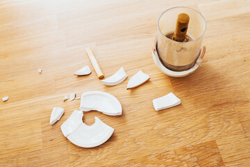 White shards of broken ceramic dishes on the table - gluing and restoring