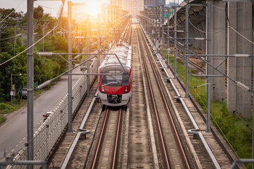 The electric train drives at high speed motion from the station  with passenger and cargo to station destination is modern trasportation concept.