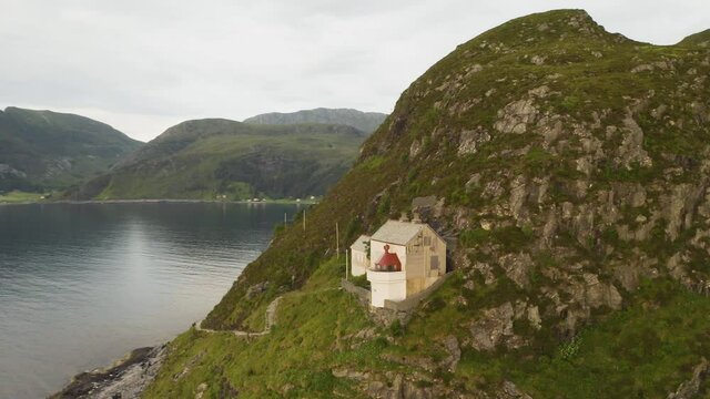 Hendanes Lighthouse in Vagsvag region near Maloy at the coast of Norway - aerial drone shot