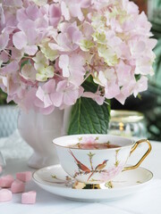 cup of tea with hydrangea flower