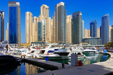 Fototapeta na wymiar Dubai Marina skyscrapers and port in Dubai, United Arab Emirates