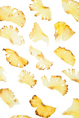 Naklejka premium pieces of dried pineapple on a transparent white background poured out Healthy food and snacks. Organic Fruit Chips