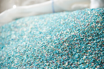 Plastic raw materials - small blue parts for the production of various products