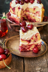 Cherry cake. Yeast bun with cherries and cream. A piece of cake. Top view, wooden and blue background.