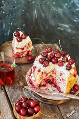 Cherry cake. Yeast bun with cherries and cream. A piece of cake. Top view, wooden and blue background.