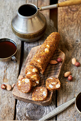 Fig and nut salami. Healthy vegan candy. Coffee