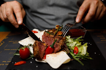 steak on the board, restaurant meat hand