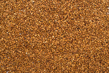 Pile of buckwheat isolated on white background. Top view. Buckwheat. Buckwheat grains. Grain culture.