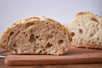 homemade bread. The sourdough bread. Side View. Wooden and white background. rustic.