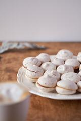 Homemade macarons. Side view, wooden background.