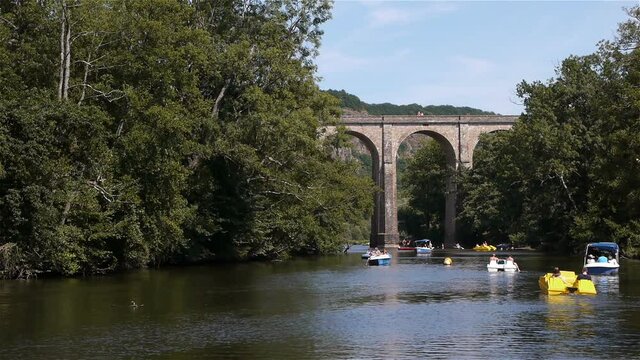 River, bridge and boats in Clecy, Normandy France