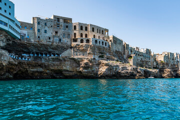 Polignano a Mare seen from the sea. Cliffs and caves