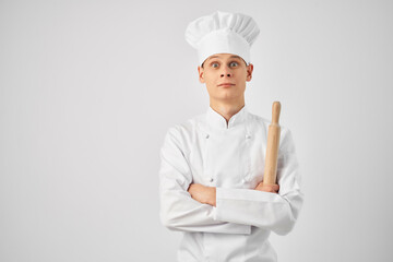 man in chef uniform kitchen profession work light background