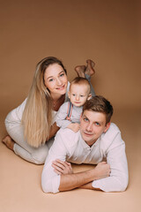 Beautiful family during the photo session in the studio