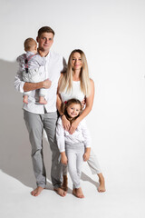 happy family smile together in the studio