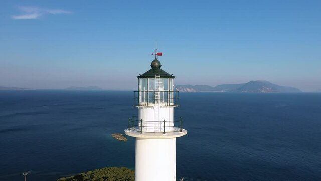 Close up aerial view of lighthouse top at the Cape of Ducato, Lefkada island, Greece.
