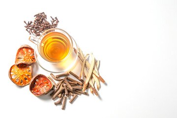 Cup of herbal tea with herb on white background. 