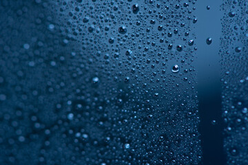 Naklejka na ściany i meble Water drops on window glass.